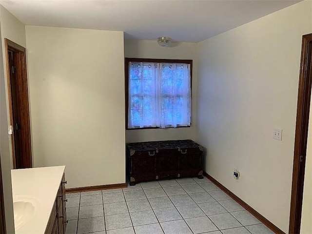 interior space with vanity and tile flooring