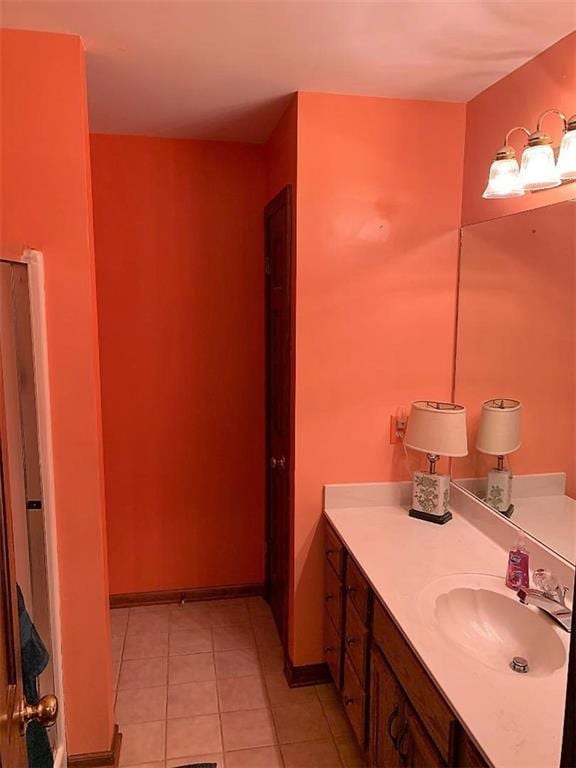 bathroom with tile floors and vanity