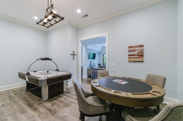 playroom with crown molding, recessed lighting, visible vents, wood finished floors, and baseboards