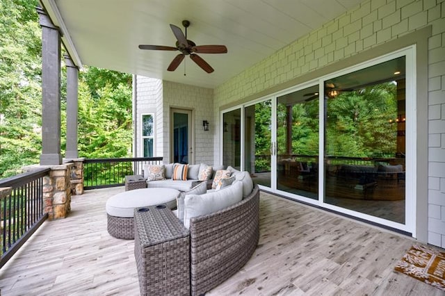 deck featuring ceiling fan and an outdoor hangout area