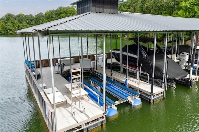 dock area with a water view and boat lift