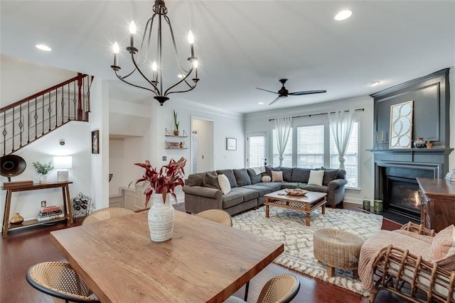 living room featuring recessed lighting, stairway, a glass covered fireplace, ceiling fan, and wood finished floors