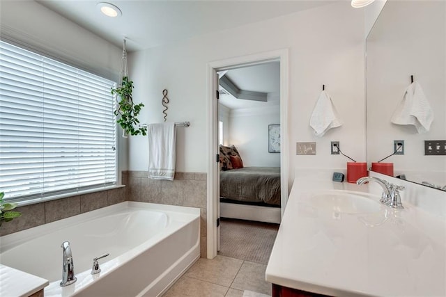 ensuite bathroom featuring tile patterned flooring, connected bathroom, vanity, and a bath