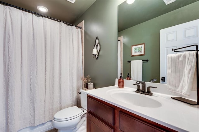 full bath featuring shower / bath combination with curtain, vanity, and toilet