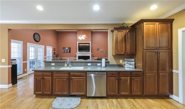 kitchen with french doors, crown molding, a sink, dishwasher, and a peninsula