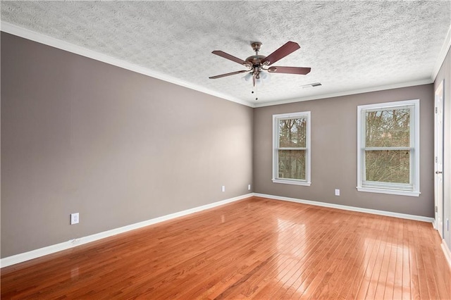 spare room with crown molding, ceiling fan, light hardwood / wood-style flooring, and a textured ceiling