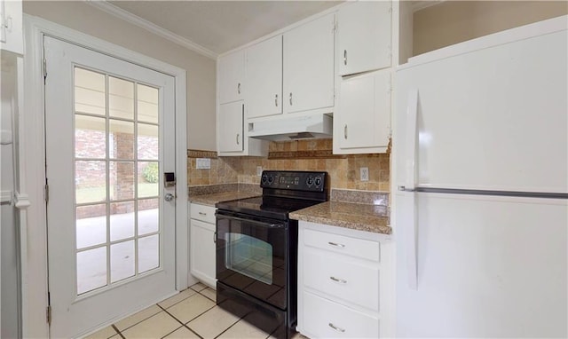 kitchen featuring white cabinets, white fridge, light tile patterned floors, and black / electric stove