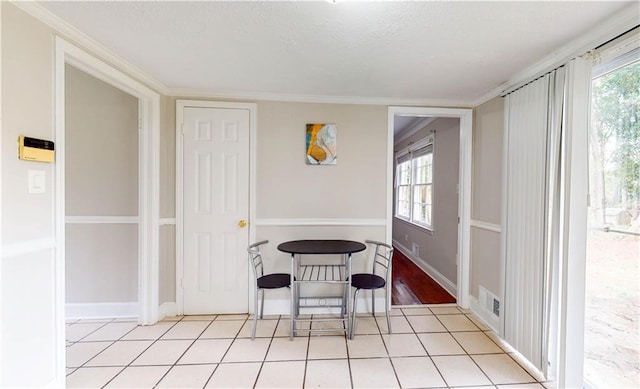 dining room with plenty of natural light and light tile patterned flooring