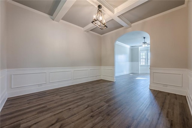 spare room featuring beamed ceiling, ornamental molding, ceiling fan with notable chandelier, and dark wood-type flooring