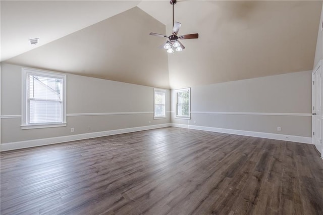 interior space featuring dark wood-type flooring, high vaulted ceiling, and ceiling fan