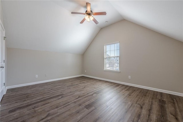 additional living space with dark wood-type flooring, ceiling fan, and vaulted ceiling