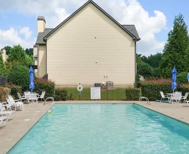 view of swimming pool with a patio area