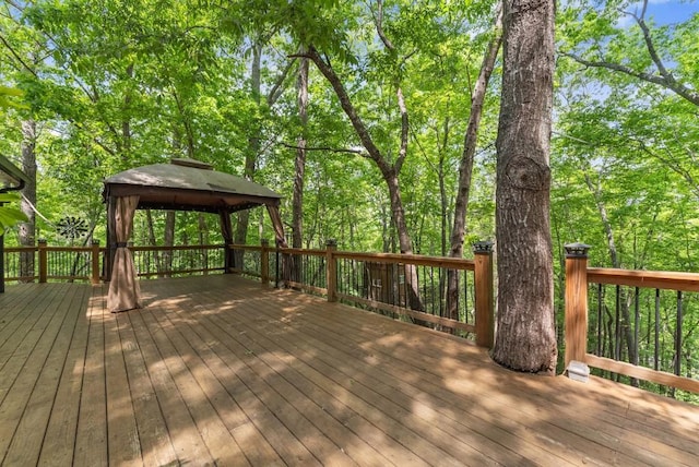 wooden deck featuring a gazebo