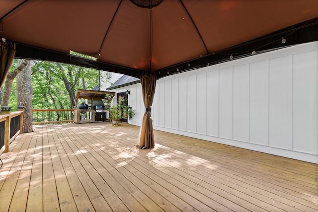 deck featuring a gazebo and area for grilling