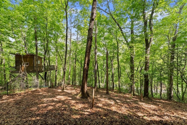 exterior space featuring a view of trees