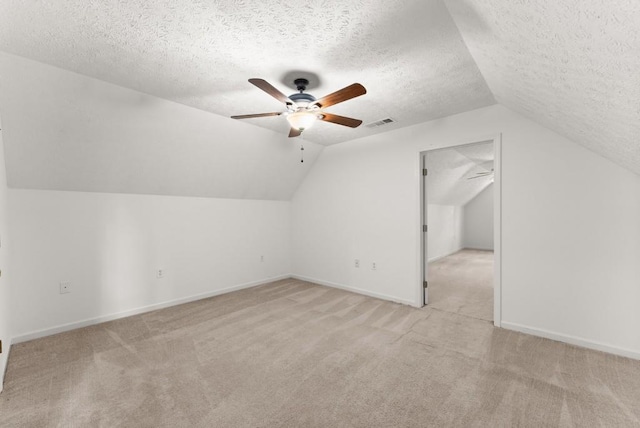 bonus room with a ceiling fan, visible vents, and light carpet