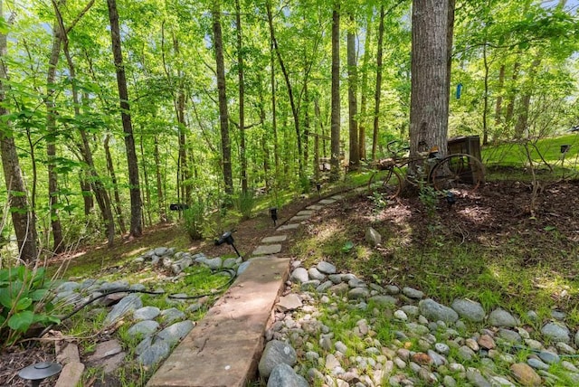 view of landscape with a forest view