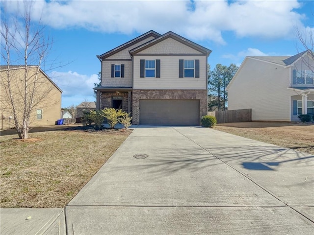 view of front of house featuring a front lawn and a garage