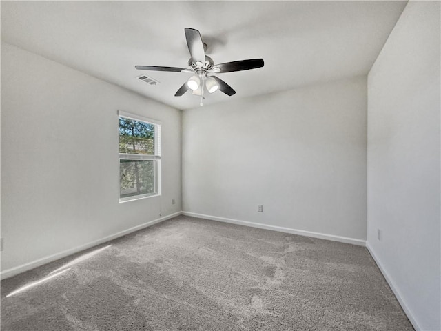 spare room featuring carpet floors and ceiling fan