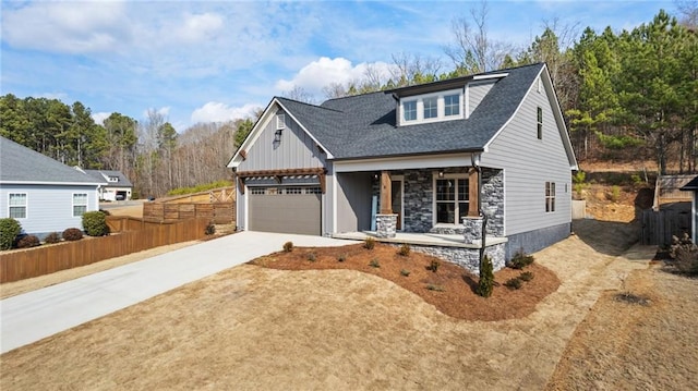 view of front facade featuring a garage and covered porch