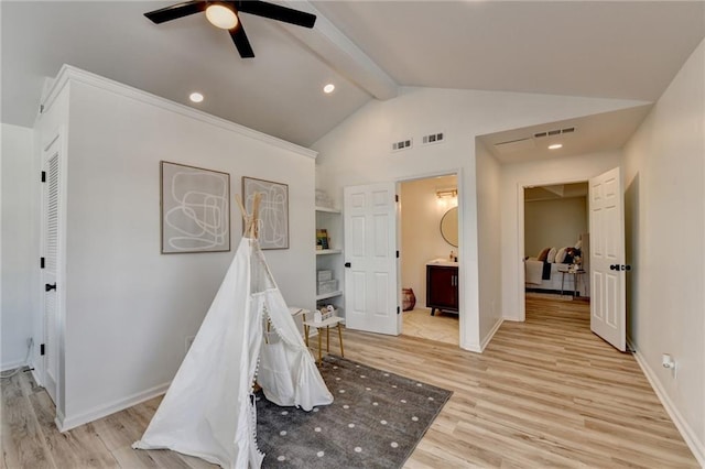 playroom featuring lofted ceiling with beams, ceiling fan, and light hardwood / wood-style flooring