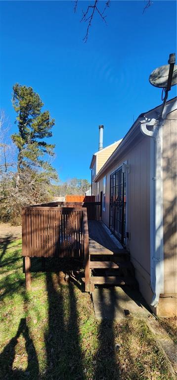 view of yard with a wooden deck