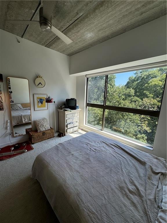 bedroom with ceiling fan and carpet