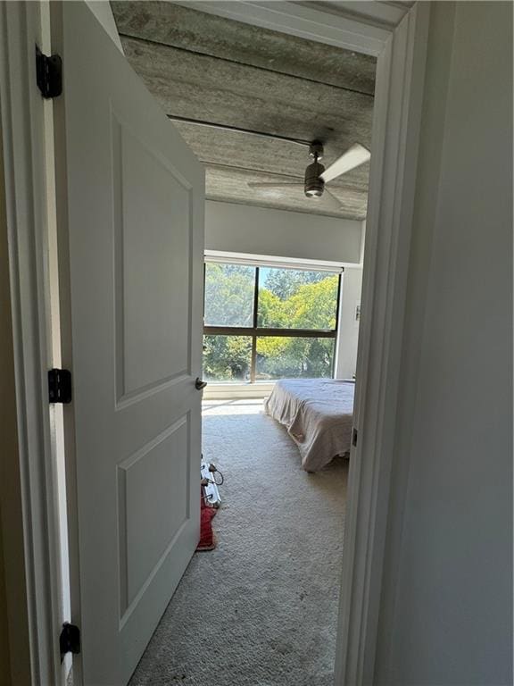 carpeted bedroom with ceiling fan