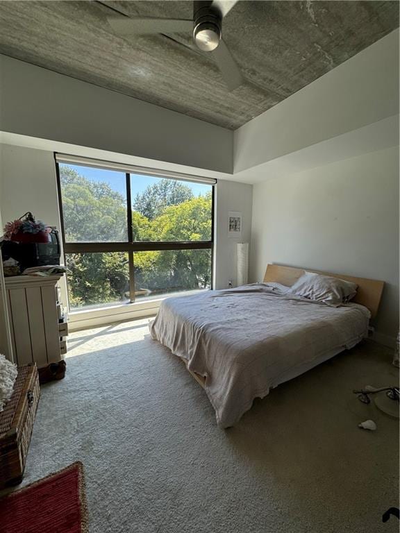 bedroom with ceiling fan and carpet