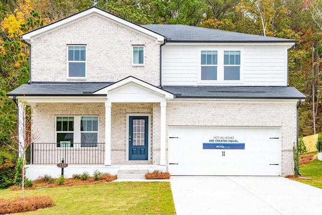 view of front facade featuring a front lawn, a porch, and a garage