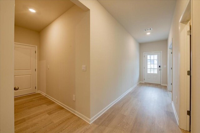 hallway featuring light hardwood / wood-style flooring