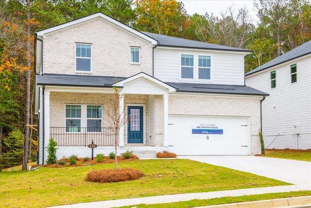 view of front facade featuring a front lawn and a garage