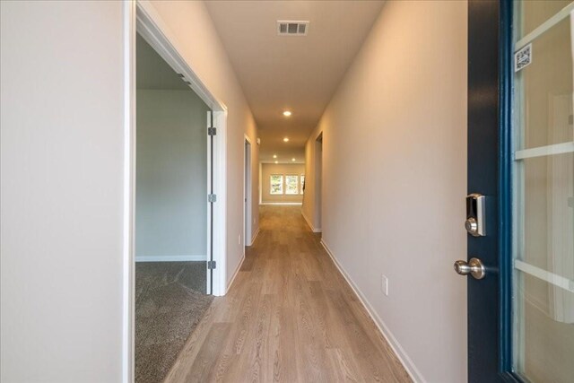 hall featuring light hardwood / wood-style flooring