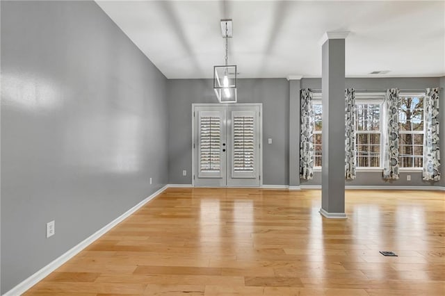 entrance foyer featuring french doors and light hardwood / wood-style floors