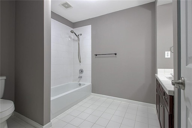 full bathroom featuring tile patterned flooring, vanity, toilet, and tiled shower / bath combo