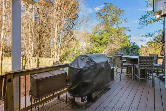 deck with exterior bar and grilling area