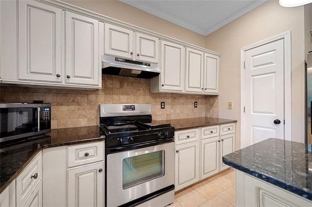 404 Pine Grove Way, Woodstock, GA 30189 - kitchen featuring appliances with stainless steel finishes, under cabinet range hood, crown molding, backsplash, and dark stone countertops