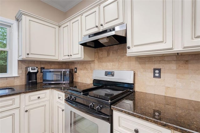 404 Pine Grove Way, Woodstock, GA 30189 - kitchen featuring appliances with stainless steel finishes, under cabinet range hood, backsplash, ornamental molding, and white cabinetry