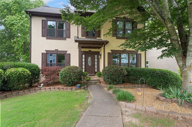 404 Pine Grove Way, Woodstock, GA 30189 - view of front of home featuring stucco siding and a front yard