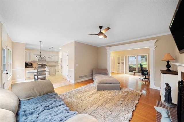 404 Pine Grove Way, Woodstock, GA 30189 - living area featuring crown molding, decorative columns, baseboards, light wood finished floors, and recessed lighting