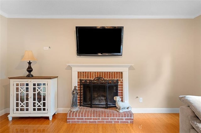404 Pine Grove Way, Woodstock, GA 30189 - detailed view of wood finished floors, crown molding, a brick fireplace, and baseboards
