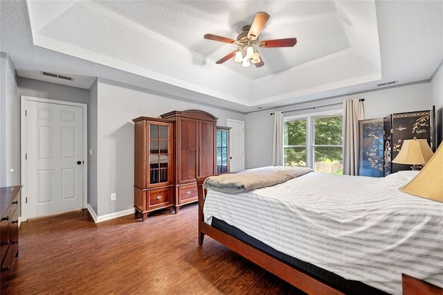 404 Pine Grove Way, Woodstock, GA 30189 - bedroom featuring a raised ceiling, wood finished floors, baseboards, and a ceiling fan