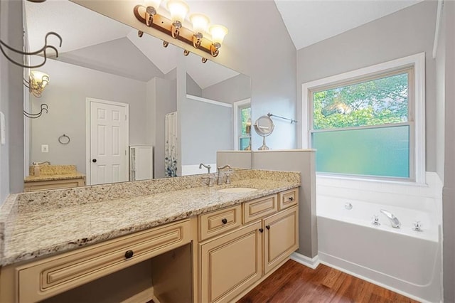 404 Pine Grove Way, Woodstock, GA 30189 - full bath with lofted ceiling, wood finished floors, vanity, a bath, and a shower with curtain