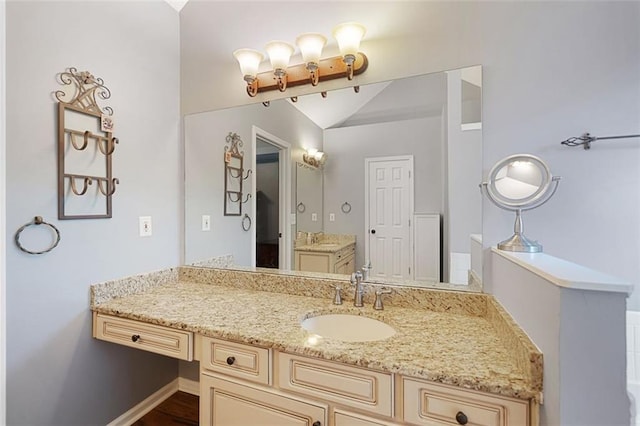 404 Pine Grove Way, Woodstock, GA 30189 - bathroom featuring vanity and lofted ceiling