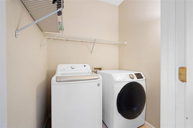 404 Pine Grove Way, Woodstock, GA 30189 - laundry area featuring washing machine and dryer and baseboards