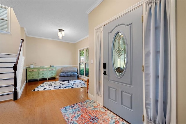 404 Pine Grove Way, Woodstock, GA 30189 - foyer featuring crown molding, wood finished floors, baseboards, and a textured ceiling