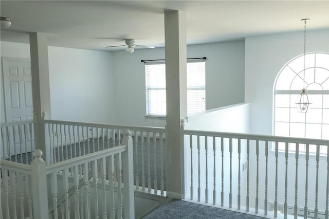 hallway with carpet floors