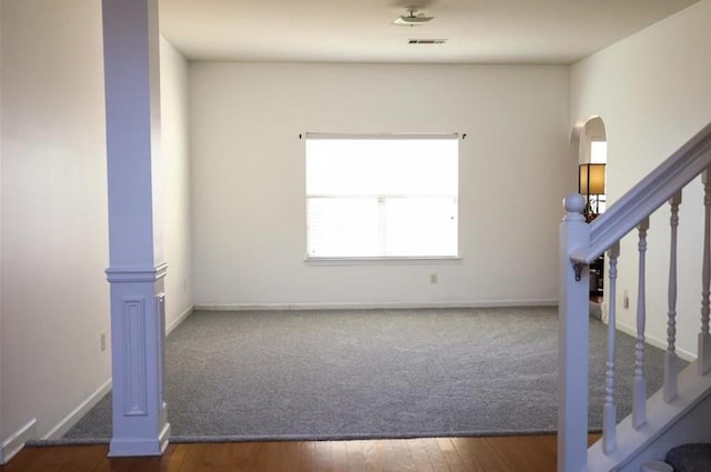 unfurnished room featuring dark hardwood / wood-style floors