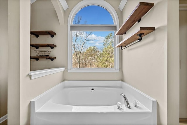 bathroom featuring a bath