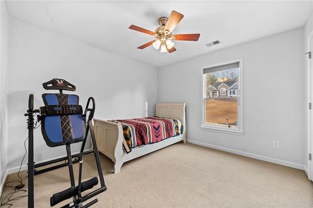 bedroom with ceiling fan and carpet flooring